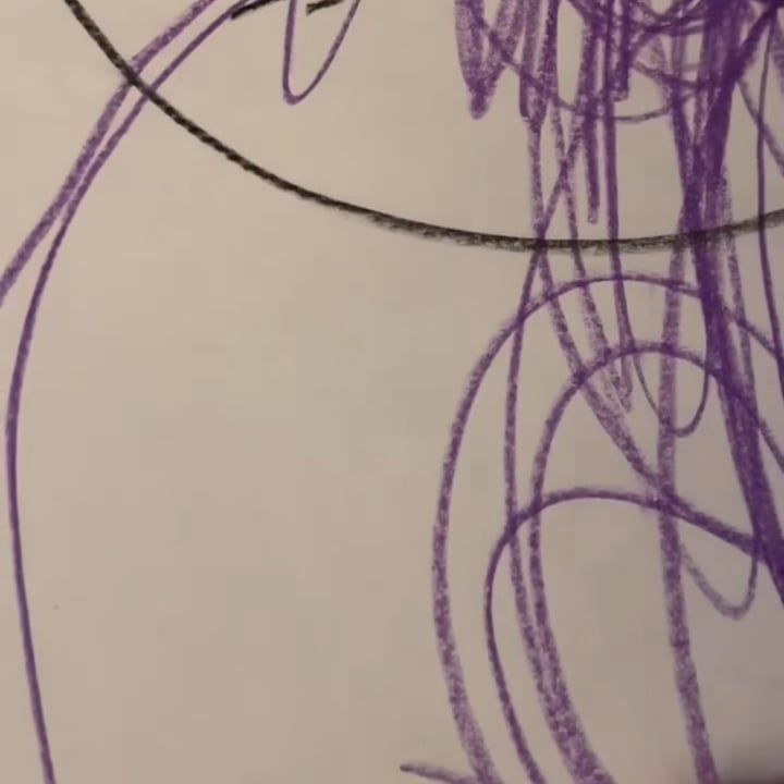 Looping purple crayon lines and one long black arc on white paper.